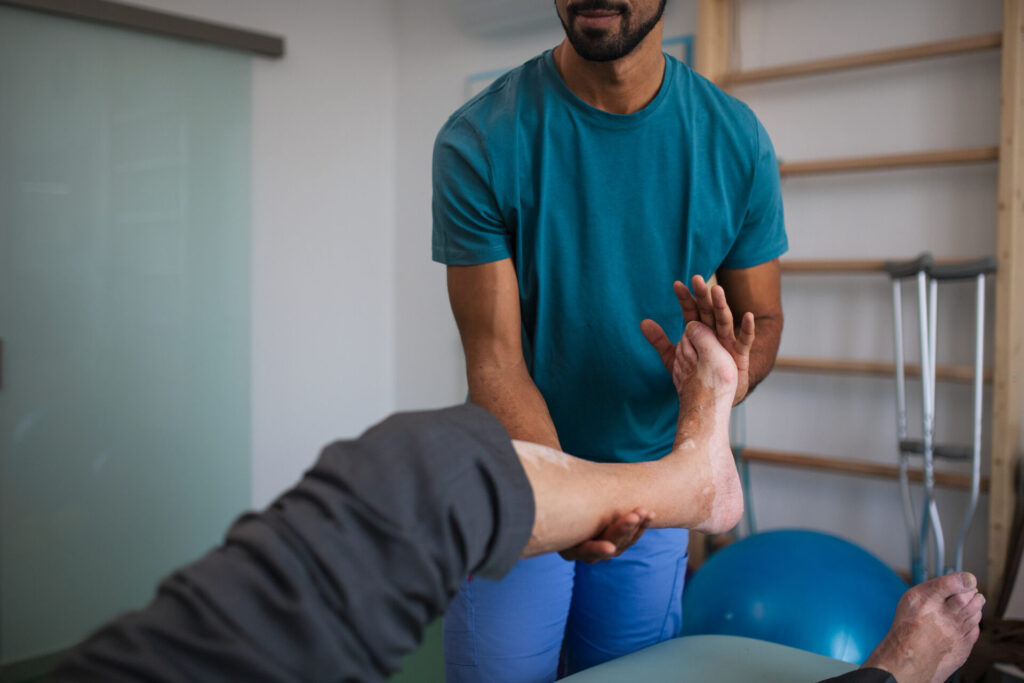 close up of physiotherapist exercising with senior 2024 10 18 08 33 04 utc